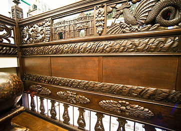 Carved details including the Green Man, a castle and knight