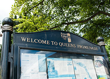 Community notice board along Queen's Promenade